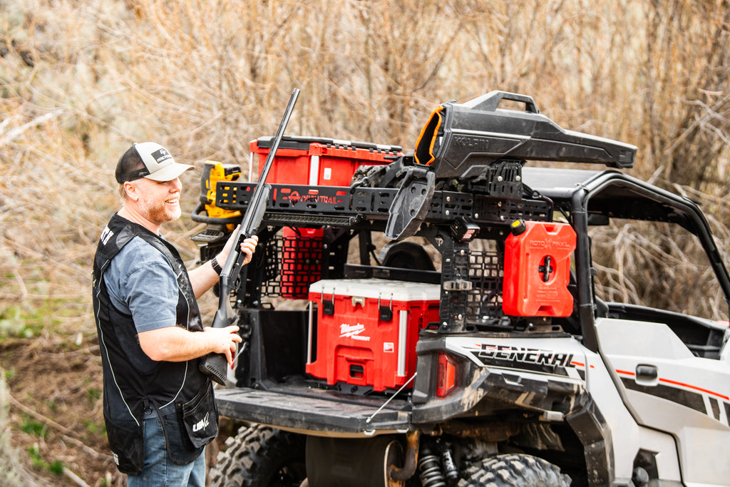 OPEN TRAIL universal UTV bed rack mounted on a utility vehicle, showcasing durable steel construction and secure installation.