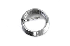Helicoil electrical thread insert for spark plugs, showing the metal coil used to strengthen and repair threaded holes in engine components.
