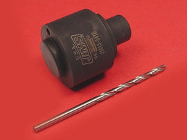 Jims Pinion Bushing Drill Jig Tool for engine repair, showing the precise metal jig with drill guide in use.