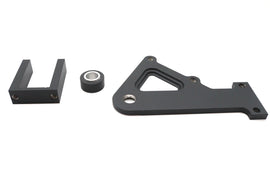 Black Ultima ULTIMA Rear FXR brake caliper bracket mounted on motorcycle, showcasing durable metal construction and mounting points.