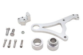 Polished Ultima rear brake caliper bracket showing detailed metal finish and mounting points on a brake assembly.
