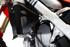 Black WORKS Radiator Braces guards shown on a vehicle, designed to protect and support the radiator.