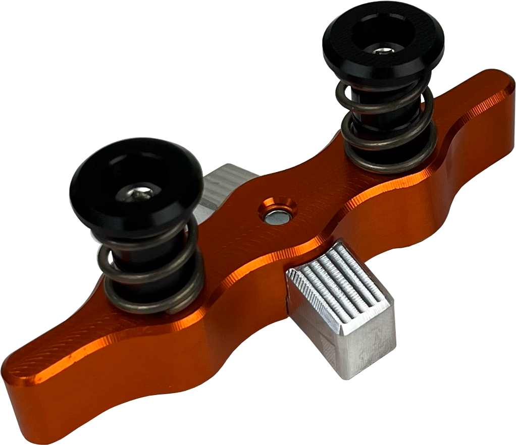 TAMER Tamer Double Button X Wing suspension in bright orange with dual buttons and aerodynamic X Wing design.