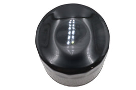 Black Ultima Microglass Spin-On Oil Filter installed in an oil tank, designed for efficient engine oil filtration.