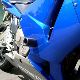 Black SHOGUN Frame Sliders for motorcycle body protection, shown mounted on a bike in the image.