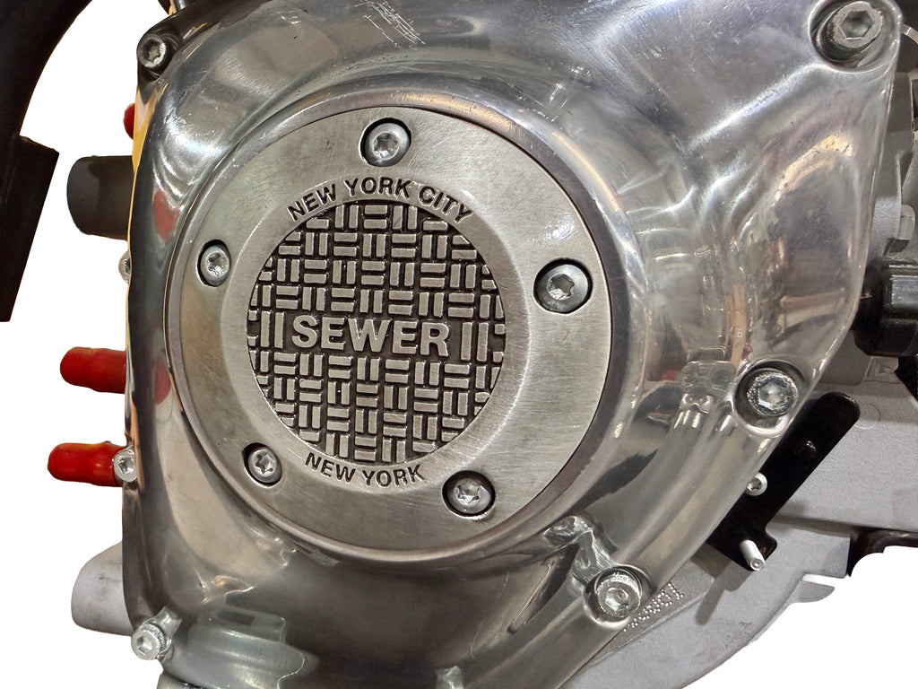V-Twin NYC TC-88 electrical ignition cover with five holes, designed for Harley-Davidson engine ignition systems.
