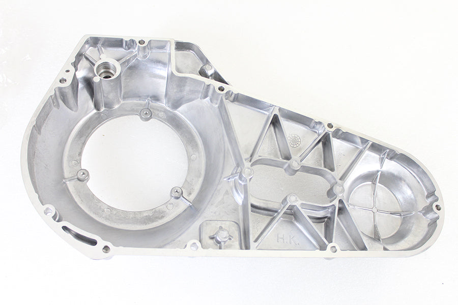 Polished MotorShop drive line outer primary cover showing smooth, shiny metal finish on a motorcycle engine component.