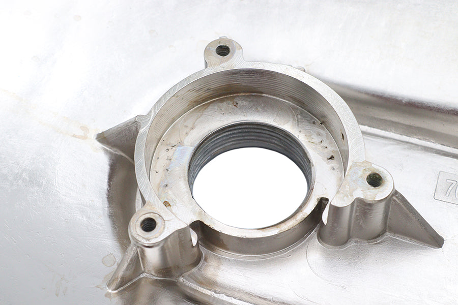 Chrome outer primary cover for drive line from MOTORSHOP, showcasing a shiny, smooth chrome finish on a motorcycle engine component.