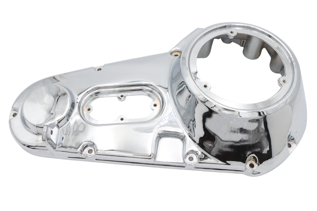 Chrome outer primary cover for motorcycle drive line by Motorshop, factory sample with sleek chrome finish and detailed design.