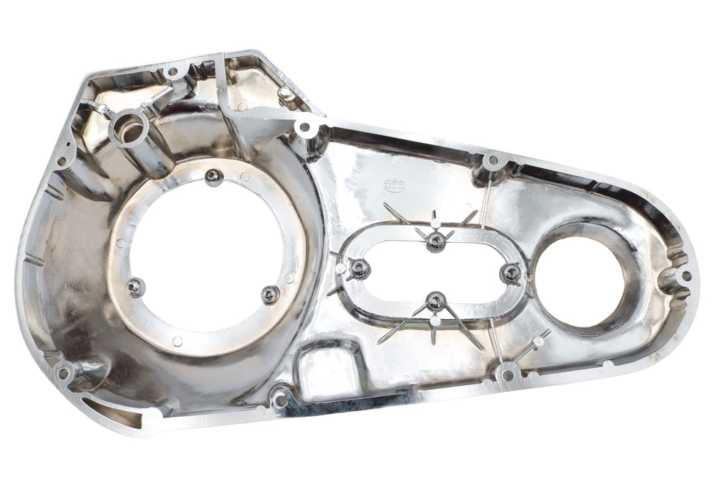 Chrome outer primary cover for drive line from MOTORSHOP, factory sample with polished finish, designed for motorcycle engine protection.
