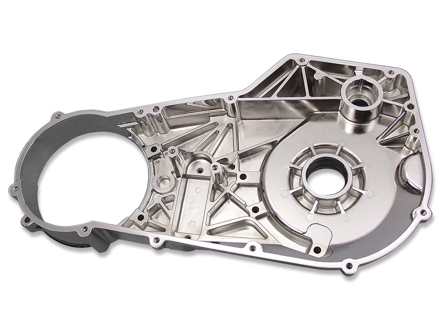 Chrome inner primary cover for motorcycle drive line by MOTORSHOP, showcasing a polished, reflective finish on a sleek metal component.