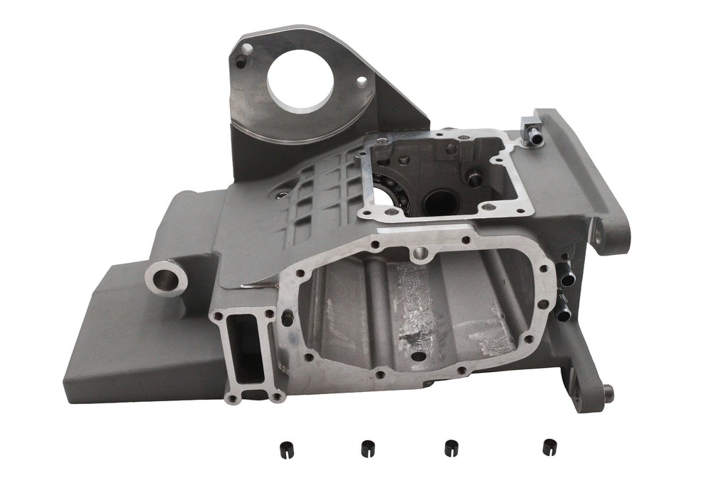 Silver Ultima 6-speed transmission case, durable metal housing for automotive performance, shown in a close-up image.