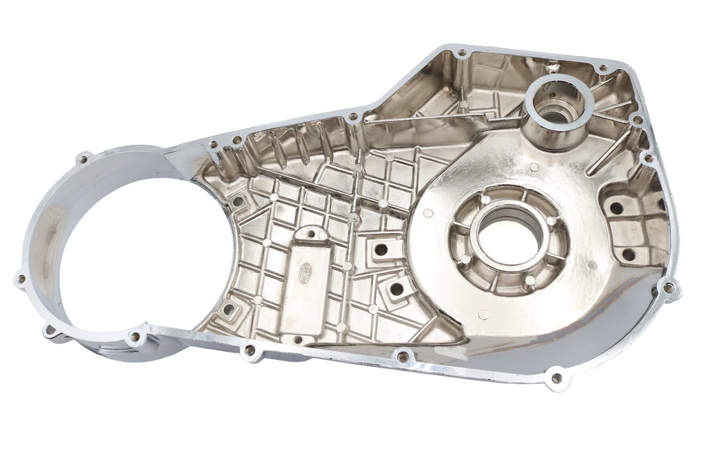 Chrome inner primary cover for motorcycle drive line by Motorshop, showing a shiny, polished chrome finish and detailed mounting edges.