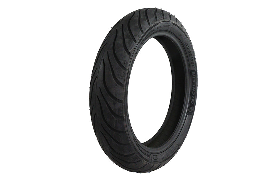 Michelin Commander III 130/80 B17 front touring motorcycle tire mounted on wheel, black rubber with tread pattern visible.