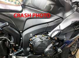 Black SHOGUN body frame sliders for motorcycle protection, shown mounted on a bike frame in a close-up view.