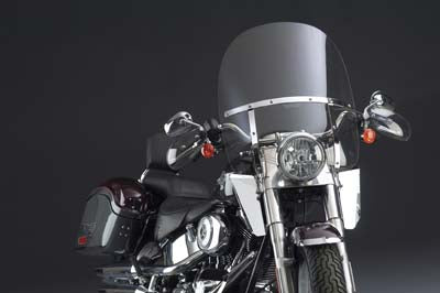 National Cycle Switchblade detachable clear 2-up windshield attached to a motorcycle, providing wind protection for rider and passenger.