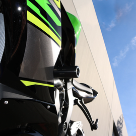 Black SHOGUN Pr/Frame Sliders for Kawasaki motorcycle, body protection with durable design and secure attachment visible in the image.