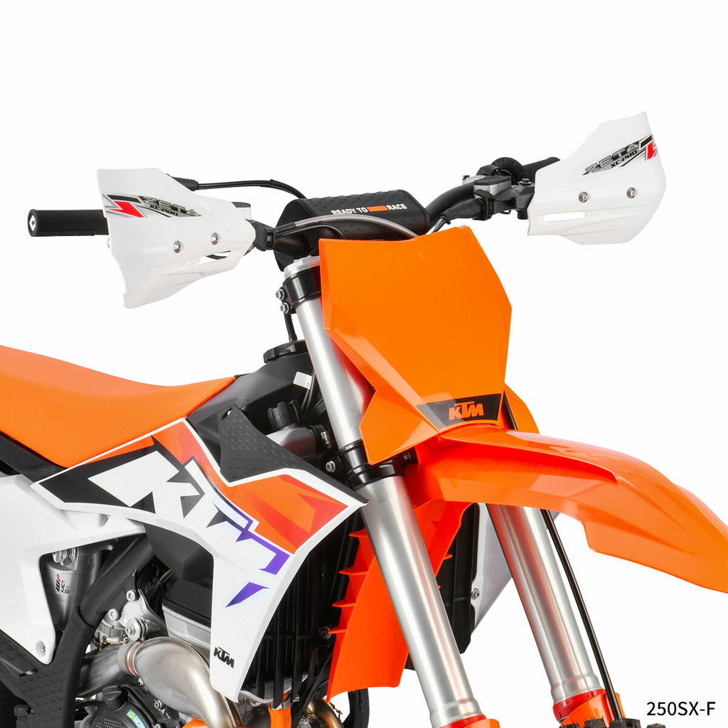 White ZETA Xc Pro Convert handguard mounted on a motorcycle handlebar, showcasing durable design and protective features.
