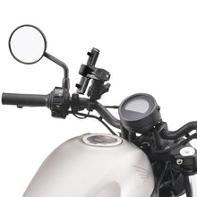 Load image into Gallery viewer, ZETA Tough Lock phone mount accessory with secure grip and adjustable arms for smartphones, shown attached to a vehicle dashboard.