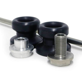 Black front axle sliders for motorcycle body protection, branded SHOGUN, shown installed on a bike for impact absorption.