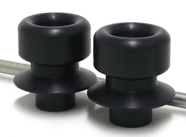 Black front axle sliders for motorcycle protection, designed by SHOGUN, mounted on a vehicle body in the image.