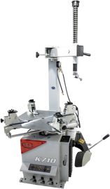 Gray K710 Tire Changer tool by K&L, featuring a sturdy metal frame and ergonomic handle for easy tire removal and installation.