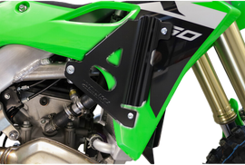 Black WORKS radiator braces guards for Kawasaki motorcycles, providing protection and support for the radiator.