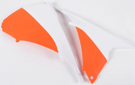 Acerbis Airbox Covers in white and orange with black accents for motorcycle air intake protection and style.