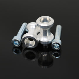 DMP Swingarm Spools 6mm in silver color, designed for motorcycle body, mounted on a bike's swingarm for wheel maintenance.