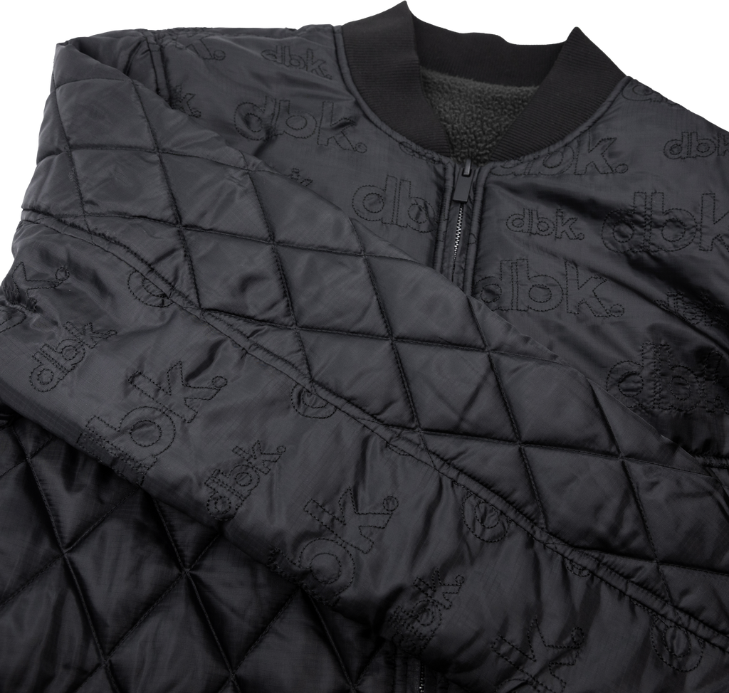Black DBK liner jacket, 3X size, shown with front zipper, stand-up collar, and padded interior for warmth.
