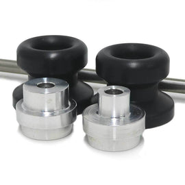Black SHOGUN front axle sliders mounted on a motorcycle body, designed for protection and style.
