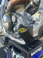 P3 brand Yamaha skid plate guard made of carbon fiber, designed to protect the motorcycle's underside during rides.