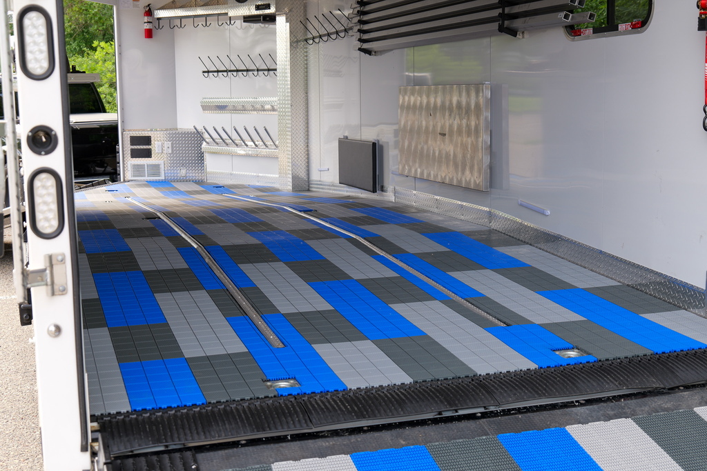 Caliber Protech flooring in smooth light grey, 24-piece trailer/towing flooring set by Caliber, durable and easy to install.