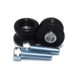 Black swingarm sliders by SHOGUN, motorcycle body protective sliders mounted on a bike's swingarm for impact protection.