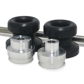 Black front axle sliders by SHOGUN designed for body protection on motorcycles, shown mounted on the vehicle.