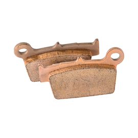 RFX rear brake pads for Kawasaki, Suzuki, Yamaha motorcycles showing brake pad set with branding and metal backing plates.