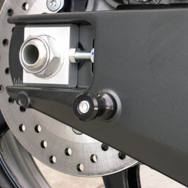 Black DMP swingarm spools for motorcycles with 8mm mounting, designed for easy installation and secure attachment.