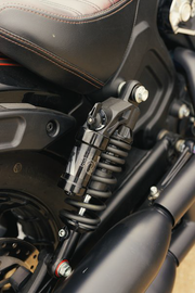 FOX Qs3 Qsr Piggyback suspension for Indian Scout Standard with spring, shown on a motorcycle rear shock absorber.