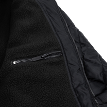 Load image into Gallery viewer, Black DBK liner jacket with a sleek design, featuring a zip-up front and lightweight fabric, ideal for layering and casual wear.