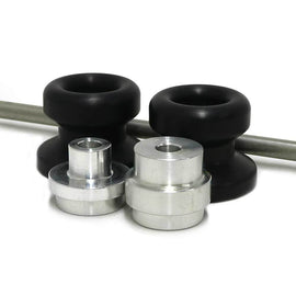 Black front axle sliders for motorcycle body protection, branded SHOGUN, mounted on a bike with detailed metal components.