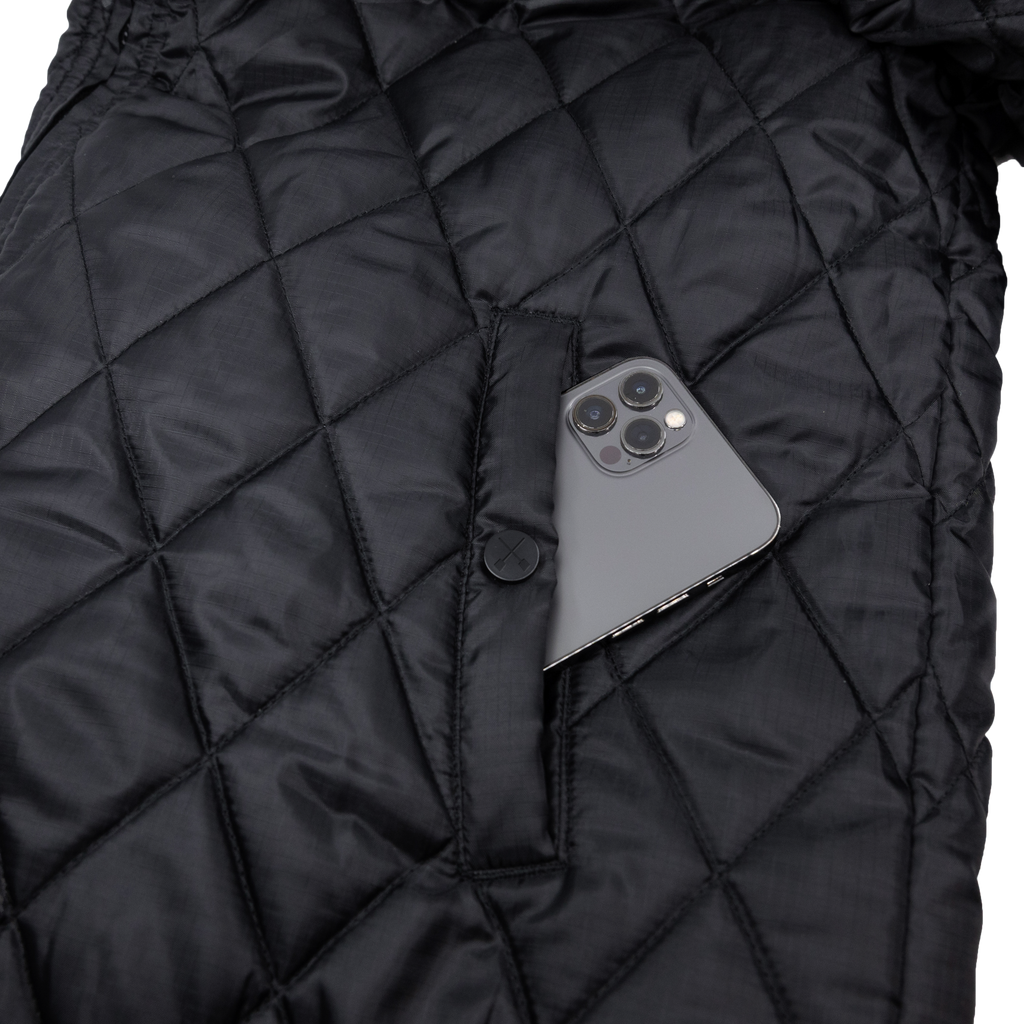 Black DBK liner jacket with a sleek design, featuring a zipper and lightweight construction, ideal for layering and versatile wear.