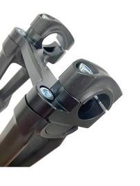 HeliBars black handlebar risers for off-road motorcycles, designed for Yamaha models, with a sleek black finish.