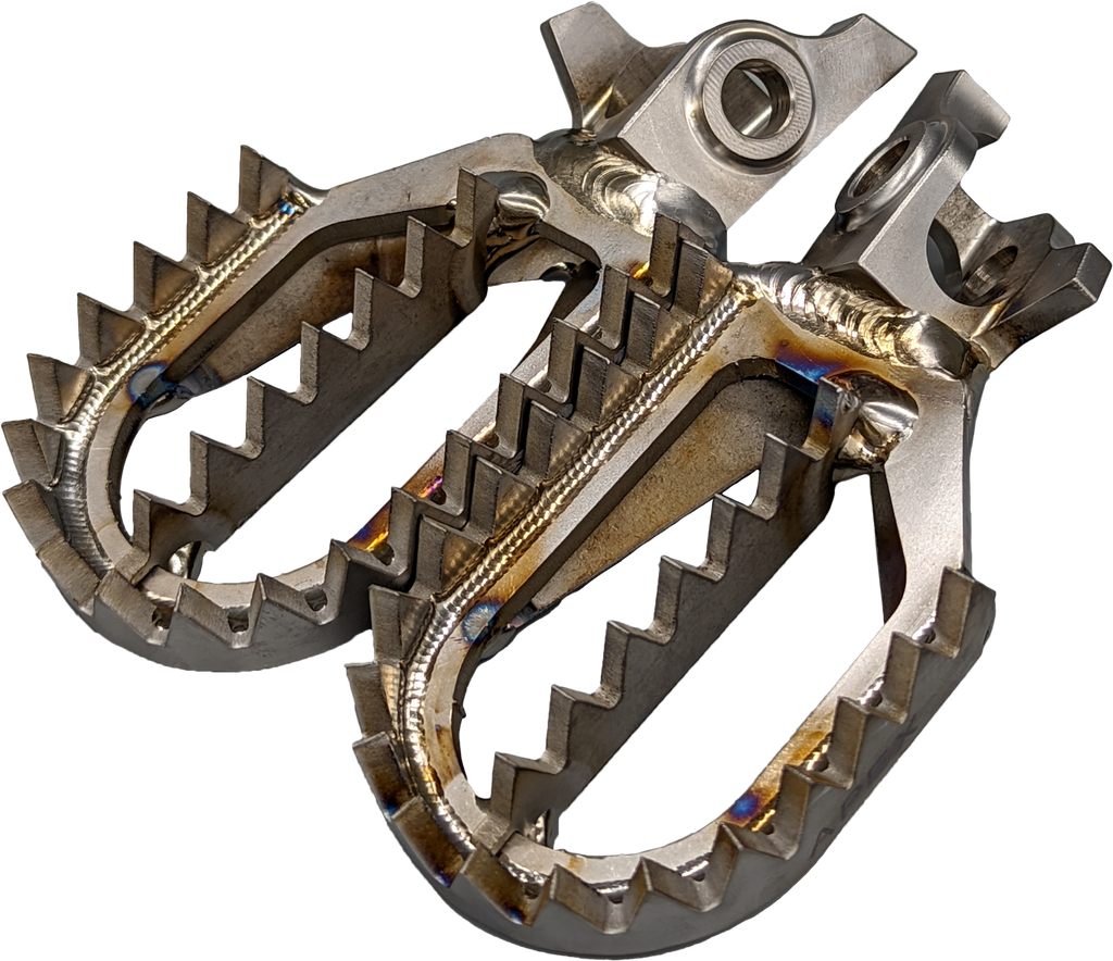 Raptor titanium foot pegs for motorcycle foot controls, showcasing durable, lightweight metal with textured surfaces for grip.