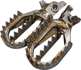 Raptor titanium foot pegs for motorcycle foot controls, showcasing durable, lightweight metal with textured surfaces for grip.