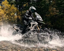 Raptor titanium foot pegs for motorcycle foot controls, featuring advanced triangular design for durability and style.
