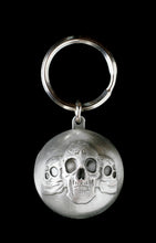 Load image into Gallery viewer, Ryder Clips All Balls Ryder Ball with three skulls, body jewelry accessory featuring skull design and vibrant colors.
