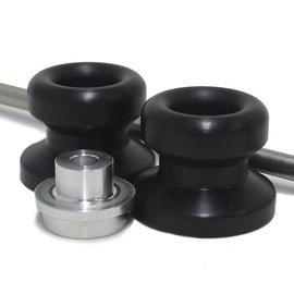 Black Shogun front axle sliders for motorcycle body protection, visible mounted on the front axle in the image.