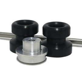 Black front axle sliders for motorcycle body protection, made by SHOGUN, shown installed on a bike for impact absorption.