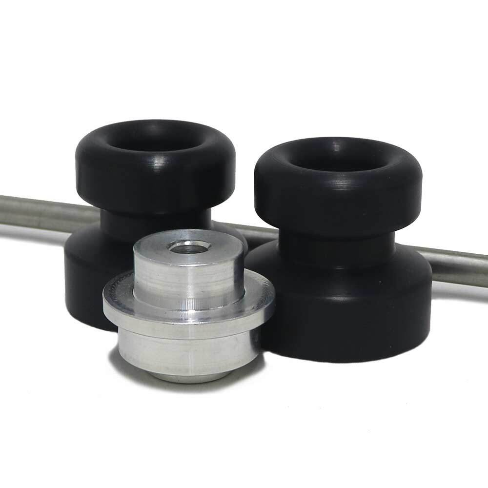Black Shogun front axle sliders for motorcycle body protection, shown mounted on the vehicle in the image.