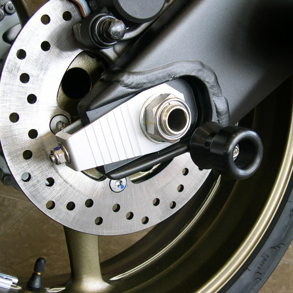 Shogun black swingarm sliders for motorcycle body protection, featuring durable mounting points and sleek black design.